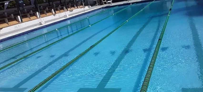 Swimming pool marked out with lane lines and lane markers for lap swimming